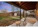 Nice backyard with a covered patio and string lights, perfect for outdoor gatherings at 4344 Wyandot St, Denver, CO 80211