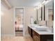 Tasteful bathroom with double sinks, dark wood cabinets, and stylish lighting at 4344 Wyandot St, Denver, CO 80211