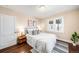 Bright bedroom with hardwood floors, neutral walls, and sunny window at 4344 Wyandot St, Denver, CO 80211