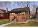 Charming brick home with a cozy front porch and well-maintained lawn at 4344 Wyandot St, Denver, CO 80211