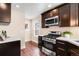 Modern kitchen featuring stainless steel appliances and sleek cabinetry at 4344 Wyandot St, Denver, CO 80211