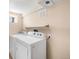 Bright laundry room featuring a washer and dryer with beige wall and window at 4344 Wyandot St, Denver, CO 80211