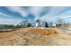 Spacious backyard with potential, featuring a chain-link fence and a blue home exterior at 3282 W 66Th Ave, Denver, CO 80221