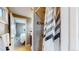 Bathroom with tiled shower and view of the bedroom at 3282 W 66Th Ave, Denver, CO 80221