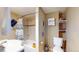 Clean bathroom with a shower/tub combo, shelving and a toilet at 3282 W 66Th Ave, Denver, CO 80221