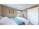 Spacious bedroom with a queen bed and built-in closet at 3282 W 66Th Ave, Denver, CO 80221