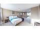 Serene bedroom with a queen-size bed and backyard access at 3282 W 66Th Ave, Denver, CO 80221