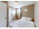 Small bedroom with full-size bed and adjacent closet at 3282 W 66Th Ave, Denver, CO 80221