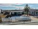 Charming home featuring a long driveway and classic curb appeal with a white picket fence at 3282 W 66Th Ave, Denver, CO 80221