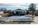 Cute bungalow with a freshly painted exterior and white picket fence at 3282 W 66Th Ave, Denver, CO 80221