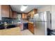 Efficient kitchen with stainless steel appliances, tile backsplash, and granite countertops at 3282 W 66Th Ave, Denver, CO 80221