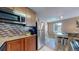 Bright kitchen with stainless steel appliances and granite countertops at 3282 W 66Th Ave, Denver, CO 80221