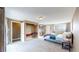 Spacious primary bedroom with ample closet space, tv, and natural light at 3282 W 66Th Ave, Denver, CO 80221