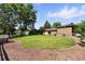 Expansive backyard features a lush lawn, privacy fence, and a charming playhouse, ideal for outdoor activities at 1380 Holly E Dr, Broomfield, CO 80020