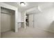 Finished basement room with white walls and carpet includes a closet, work space and view of stairs at 1380 Holly E Dr, Broomfield, CO 80020
