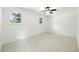 A blank canvas: Unfurnished bright and airy bedroom with ceiling fan and large window at 1380 Holly E Dr, Broomfield, CO 80020