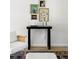 Stylish decor featuring a black table adorned with books and artwork adding character to this living space at 1380 Holly E Dr, Broomfield, CO 80020