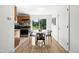 Bright dining area adjoins an updated kitchen featuring a sliding glass door and modern appliances at 1380 Holly E Dr, Broomfield, CO 80020