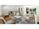 Open-concept living area blends into the kitchen and dining area, showcasing a modern design at 1380 Holly E Dr, Broomfield, CO 80020