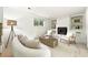 Comfortable living room with fireplace and white walls, perfect for relaxing and entertaining at 1380 Holly E Dr, Broomfield, CO 80020