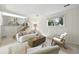 Stylish lower level living room with lots of light, white walls, and white carpet at 1380 Holly E Dr, Broomfield, CO 80020