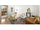 Inviting living room seamlessly connects the dining and kitchen areas, enhancing the open concept at 1380 Holly E Dr, Broomfield, CO 80020