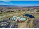 Aerial view showcasing community amenities, including pools, clubhouse, and proximity to recreation at 3502 First Light Dr, Castle Rock, CO 80109