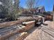 Picture of the backyard with a patio with multiple levels with chairs and a grill at 3502 First Light Dr, Castle Rock, CO 80109