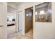 Bathroom with walk in shower and peek to the main bedroom at 3502 First Light Dr, Castle Rock, CO 80109
