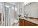 Bathroom featuring tub with shower, white tile, and granite vanity top at 3502 First Light Dr, Castle Rock, CO 80109
