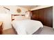 Comfortable bedroom featuring a full-size bed, dark wood furniture, and neutral tones at 3650 Chimayo Rd, Littleton, CO 80123