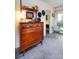 Vintage bedroom featuring a classic wooden dresser with decor, adding character to this retro style home at 3650 Chimayo Rd, Littleton, CO 80123