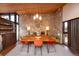 Cozy dining room with natural light and stone walls, perfect for hosting gatherings at 3650 Chimayo Rd, Littleton, CO 80123
