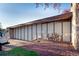 Mid-century modern exterior featuring unique architectural design and natural elements for curb appeal at 3650 Chimayo Rd, Littleton, CO 80123
