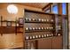 Stylish interior featuring unique shelving displaying collectibles, warm wood paneling, and vintage charm at 3650 Chimayo Rd, Littleton, CO 80123
