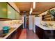 Spacious kitchen featuring wood cabinetry, modern appliances, and wood ceiling at 3650 Chimayo Rd, Littleton, CO 80123