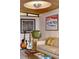 Retro living room with vintage furniture, guitars, and unique decor at 3650 Chimayo Rd, Littleton, CO 80123