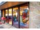 Open living room shows natural light and stone exterior at 3650 Chimayo Rd, Littleton, CO 80123