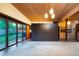 The spacious living room features a unique wood ceiling and sliding doors to the backyard at 3650 Chimayo Rd, Littleton, CO 80123