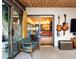 Retro-style living room with an open floor plan and patio access at 3650 Chimayo Rd, Littleton, CO 80123