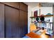 A well decorated office with a vintage wall unit included with the home at 3650 Chimayo Rd, Littleton, CO 80123