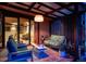 Inviting outdoor seating area with ambient lighting, comfortable furniture, and seamless indoor-outdoor flow at 3650 Chimayo Rd, Littleton, CO 80123