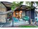 Relaxing outdoor patio area with comfortable seating, stylish decor, and ambient lighting at 3650 Chimayo Rd, Littleton, CO 80123
