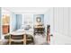 Bedroom featuring a bed, desk, and bookshelf with blue color accents at 1185 Glencoe St, Denver, CO 80220