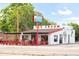 Charming ice cream shop exterior featuring vibrant signage, ample seating, and colorful decorations at 1185 Glencoe St, Denver, CO 80220