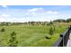 Expansive backyard featuring mature trees, green grass, and a peaceful view from the back deck at 10205 Inspiration Dr, Parker, CO 80138