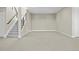 Finished basement with carpeted floor, staircase, and neutral wall color, perfect for a living space at 10205 Inspiration Dr, Parker, CO 80138