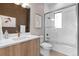 Modern bathroom with white herringbone tile and a walk-in shower at 10205 Inspiration Dr, Parker, CO 80138