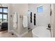 Modern bathroom with sleek soaking tub, white subway tile, and contemporary fixtures offers a spa-like experience at 10205 Inspiration Dr, Parker, CO 80138