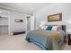 Comfortable bedroom with a large bed and access to a closet at 10205 Inspiration Dr, Parker, CO 80138